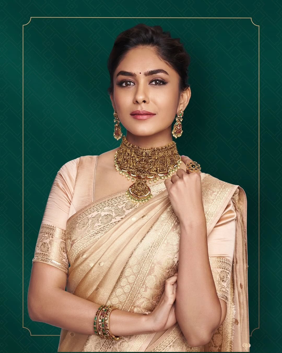 A model wearing an 18K gold choker with gemstone drops — AGN Gold & Diamonds, Thrissur