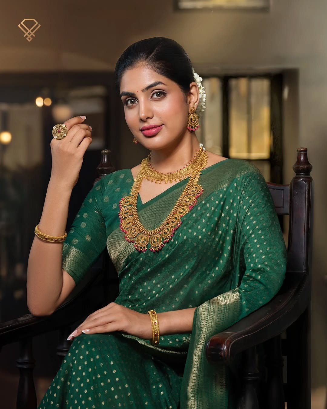 AGN 18K gold necklace on emerald silk